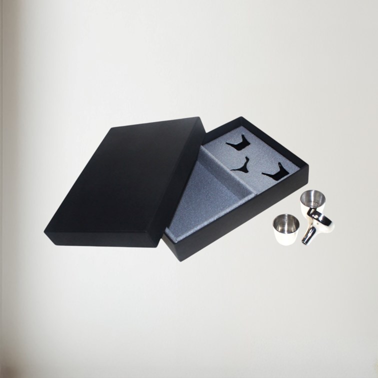 showing th ebox and insert for the nip cups and funnel