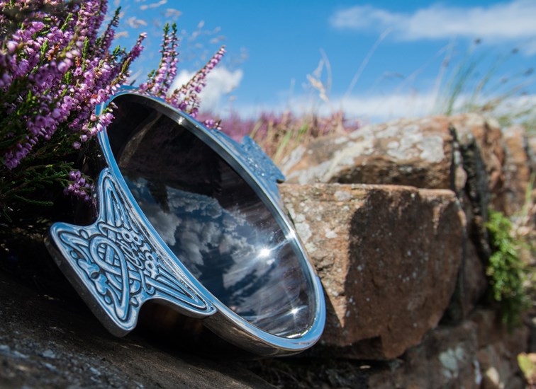 large horn and pewter quaich in heather